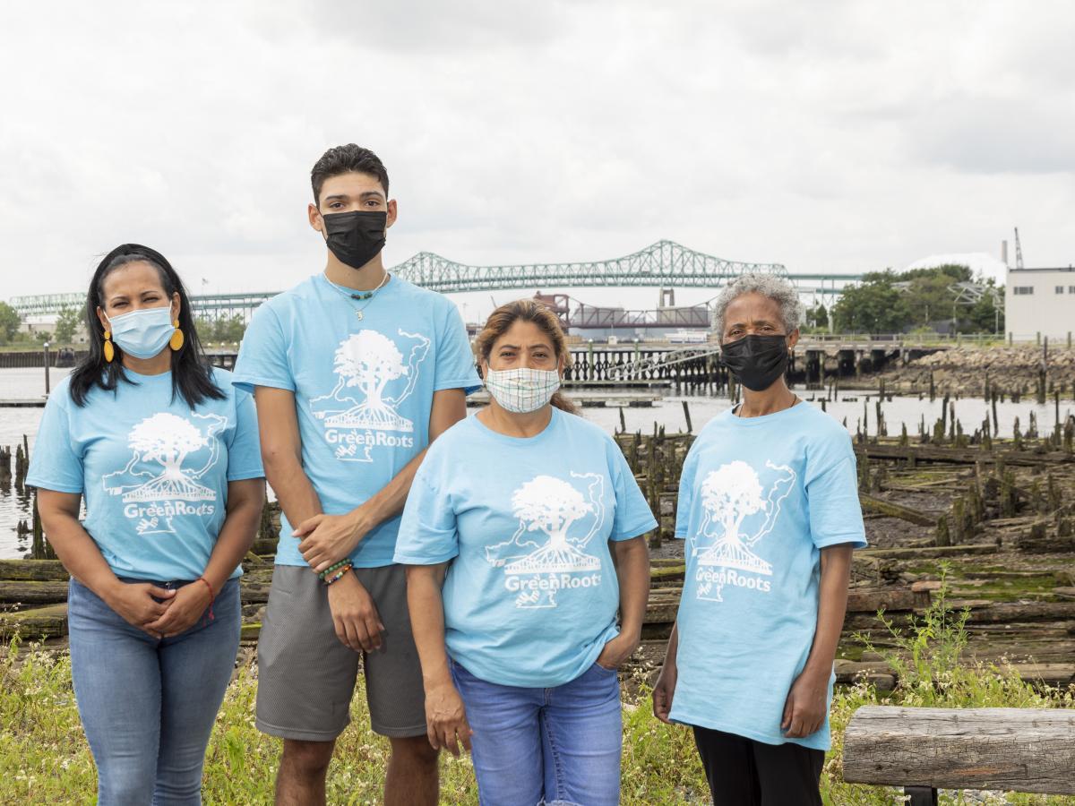 Four GreenRoots community health ambassadors in front of Chelsea Creek.