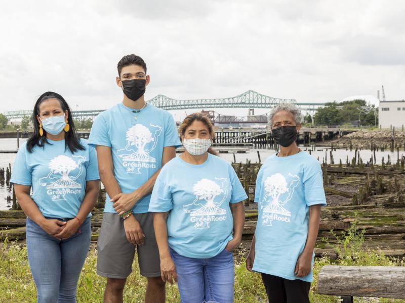Four GreenRoots community health ambassadors in front of Chelsea Creek.