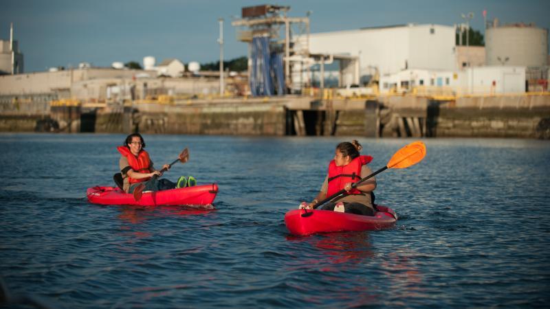 two people kayak on the Chelsea Creek