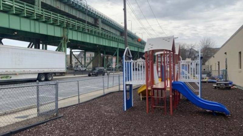Part of the Tobin Bridge crosses over a kids playground.