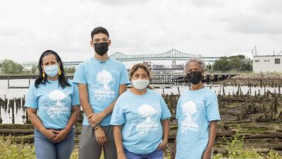 Four GreenRoots community health ambassadors in front of Chelsea Creek.