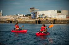 two people kayak on the Chelsea Creek