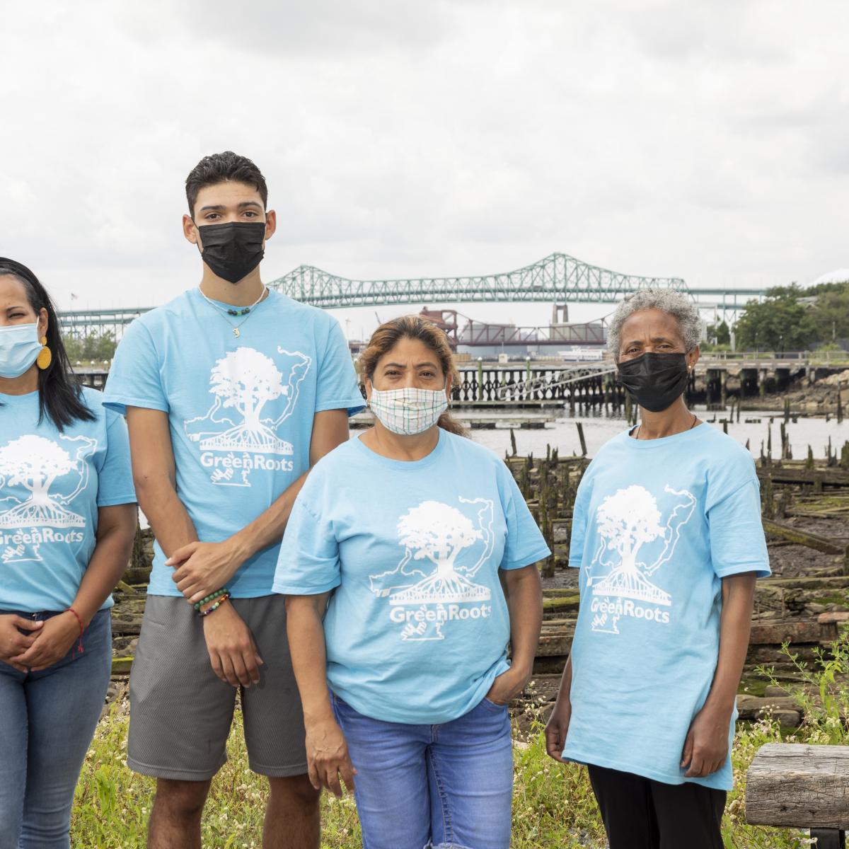 Four GreenRoots community health ambassadors in front of Chelsea Creek.